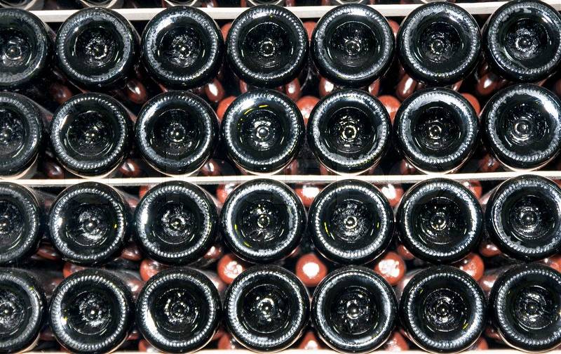 Wine bottles stored in the old wine cellar, stock photo
