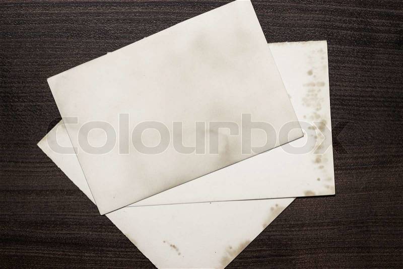 Old sheets of paper on wooden table, stock photo