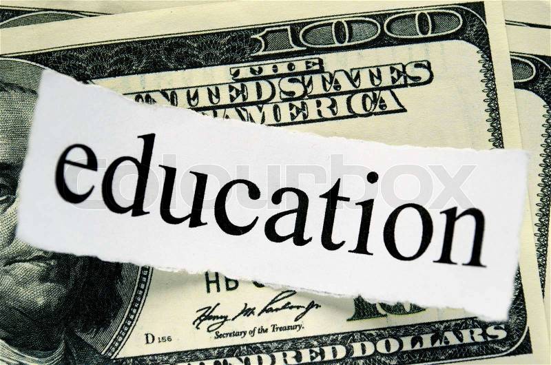 Hundred american dollars and a piece of paper with the words education, stock photo