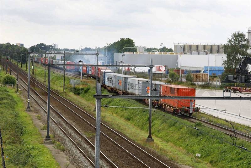 Train loaded with containers at a container terminal, stock photo