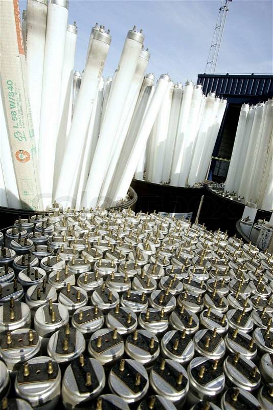 Pile of fluorescent tubes at a waste processing plant, stock photo