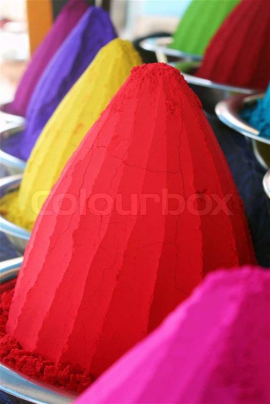 Piles and mounds of colorful dye powders for holi festival & other religious purposes commonly found in indian markets These dry rangoli powders represent colors of colorful india, stock photo
