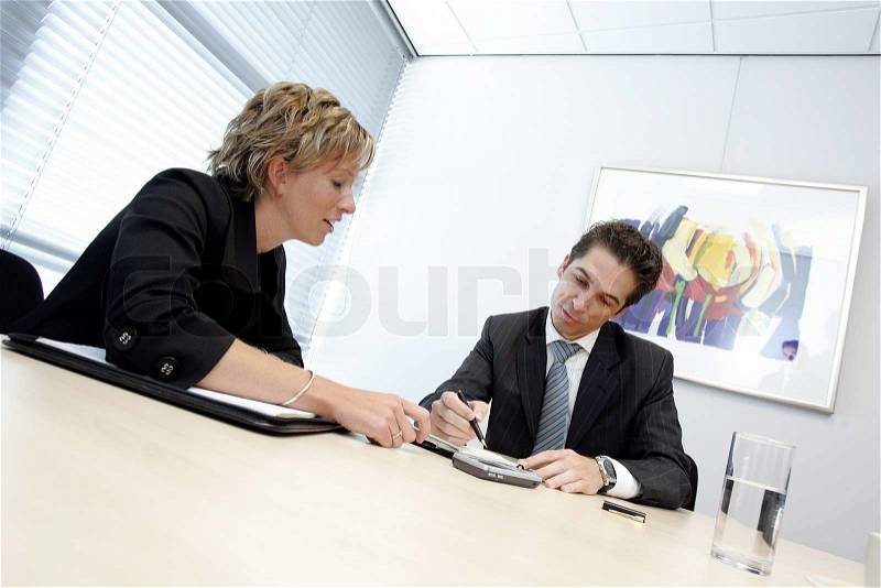 Two business people in a meeting, stock photo