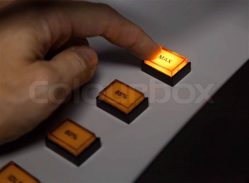 Finger pressing max button on industrial power control panel Selective focus, stock photo