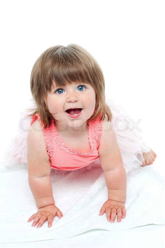 A cute little baby girl is staring up | Stock Photo ...