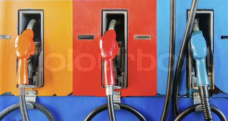 Colorful fuel oil gasoline dispenser at petrol filling station, stock photo