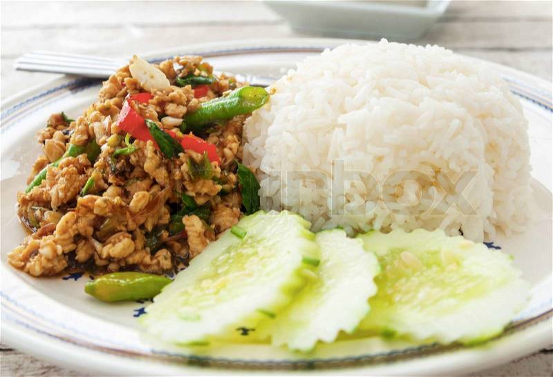 Thai spicy food basil chicken fried rice recipe Krapao Gai, stock photo