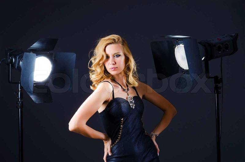 Young attractive woman in photo studio, stock photo