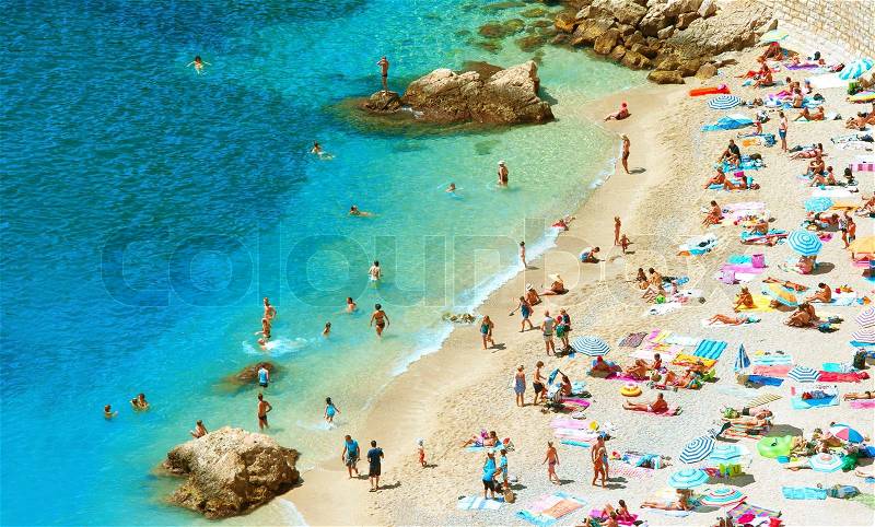 People on the beach hot summer day, stock photo