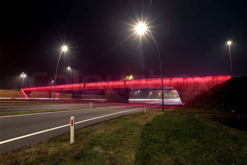 Highway viaduct with led lighting by night, stock photo