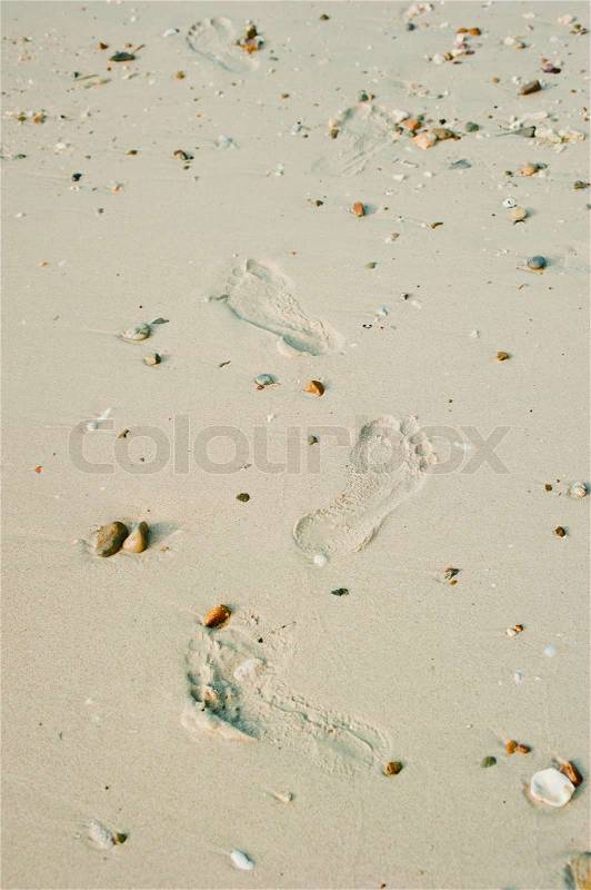 Sand background with foot print, stock photo