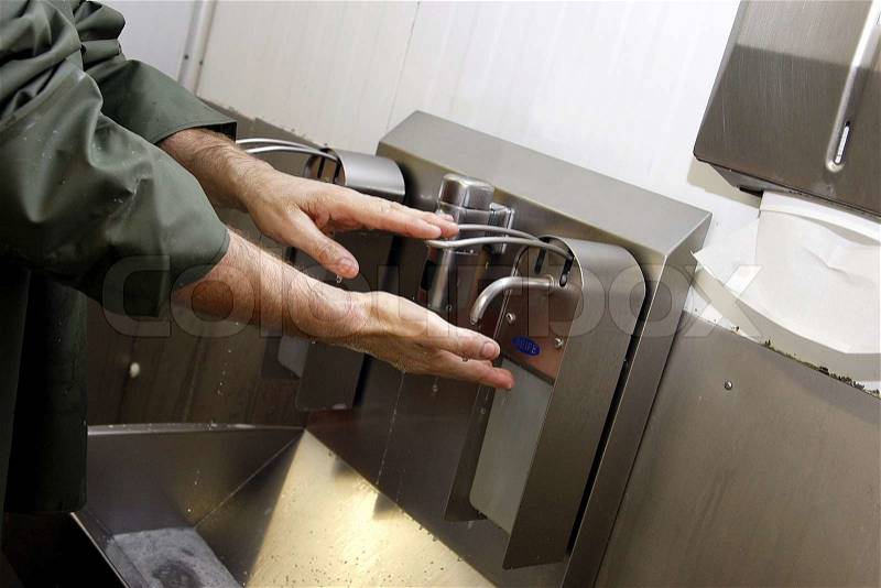Disinfecting hands, stock photo