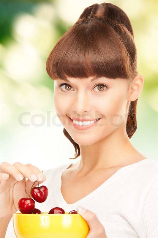 Woman with cherries, stock photo