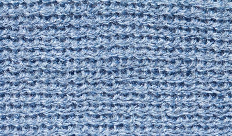Closeup of seamless blue knitted fabric texture, stock photo
