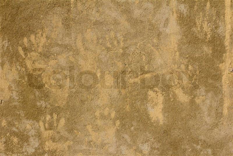 Prints of children\'s hands on a background of concrete, stock photo