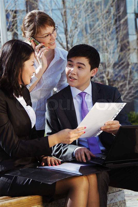 Business people meeting outdoor in front of office building, stock photo