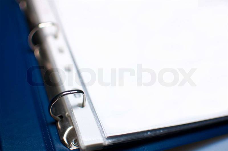Detail of Blue Open File Folder With Blank Papers, shallow depth of field, stock photo