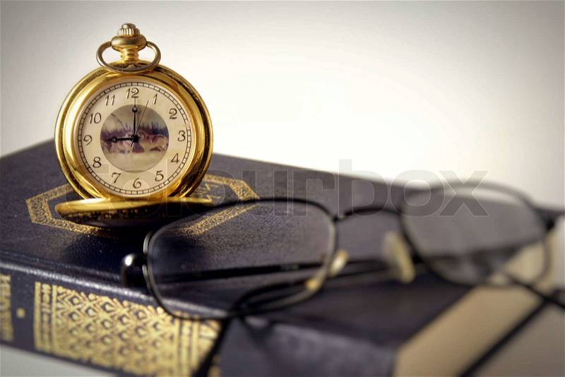 Antique clocks and book, stock photo