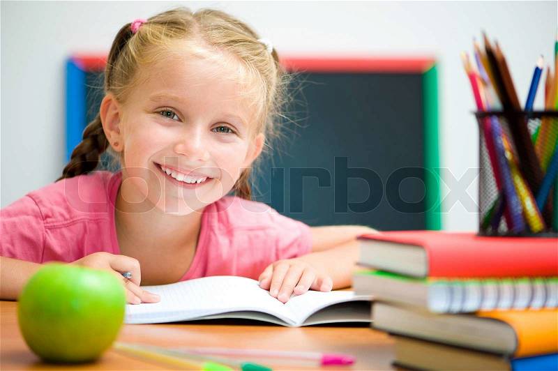 Cute girl at workplace, stock photo