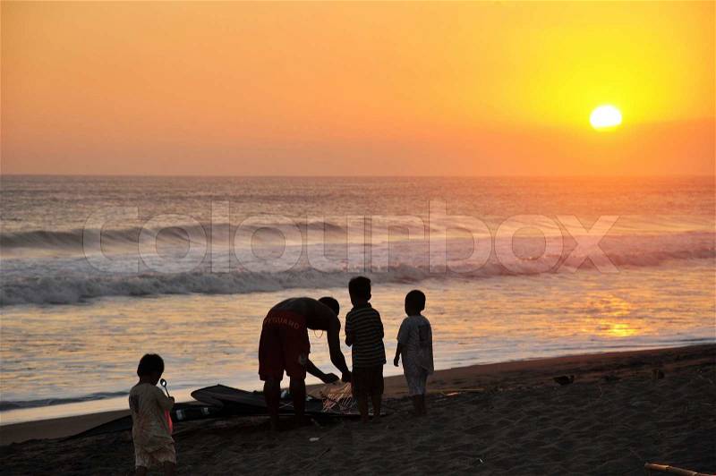 Family in sunset, stock photo