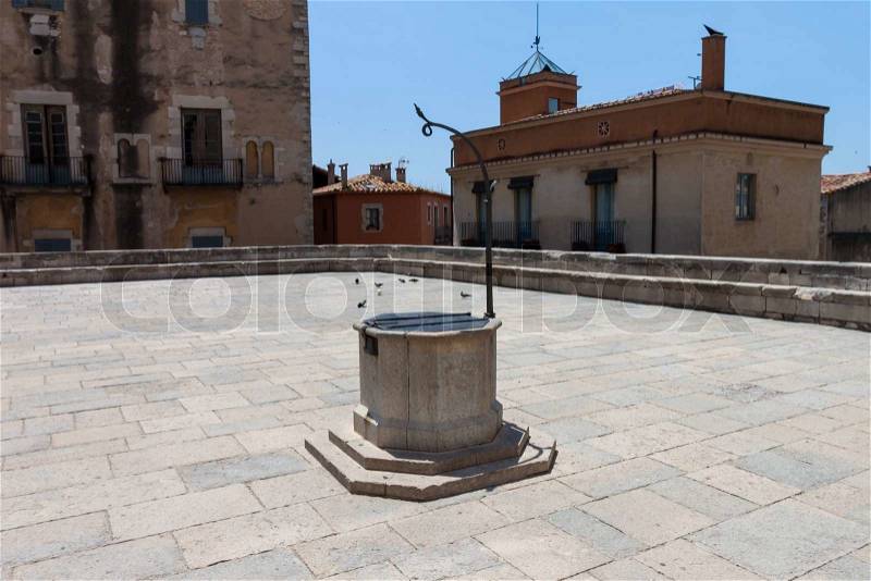 An old well, and meeting place in the old city, stock photo