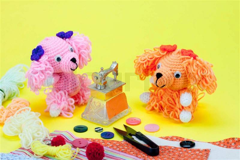 Dog knitting doll in sewing toy, stock photo