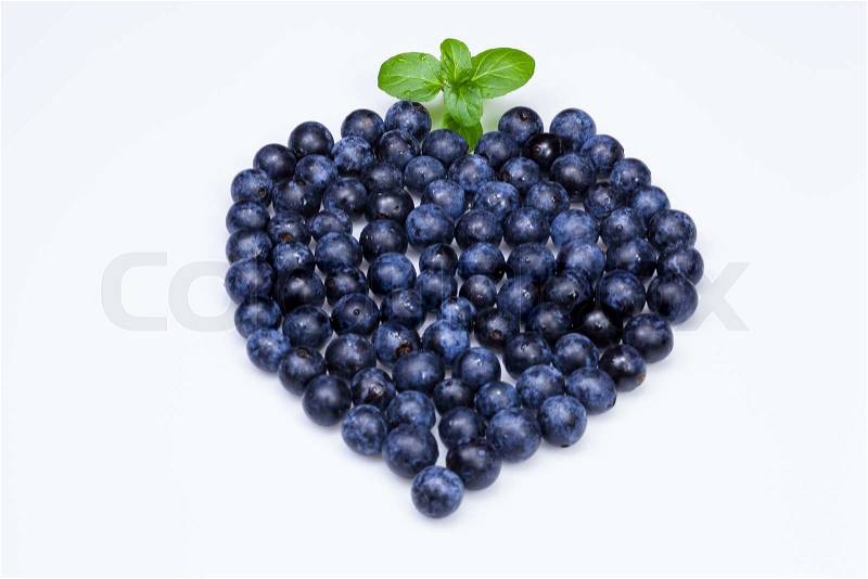 Heart shape created with Blackthorn Fruit and leaves, stock photo