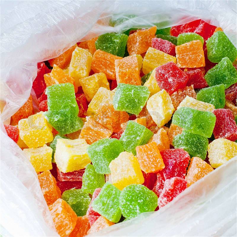 Close up of assortment of colorful candy in plastic bag, stock photo
