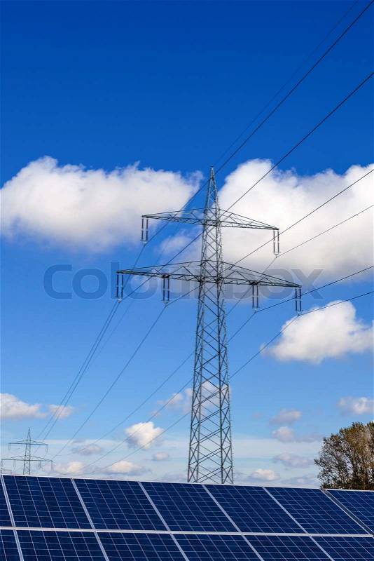 Pylons and solar cells, stock photo