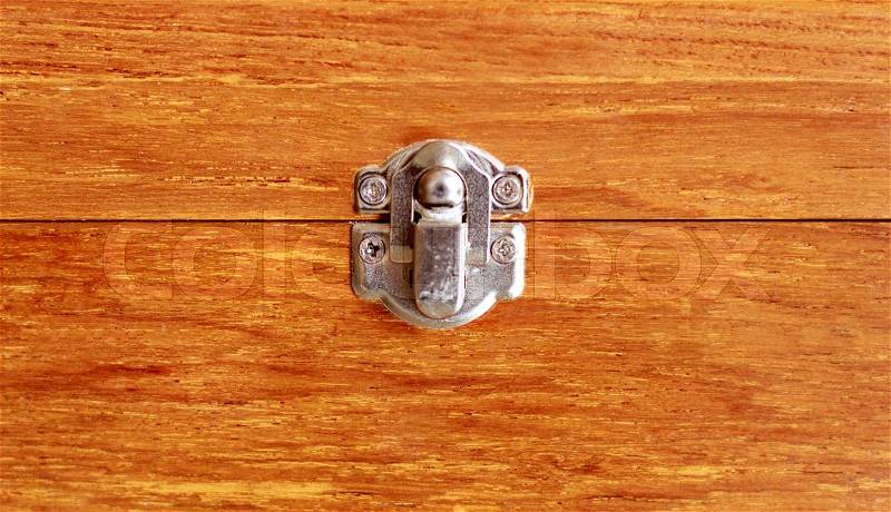 Lock key of closed old wooden box, stock photo