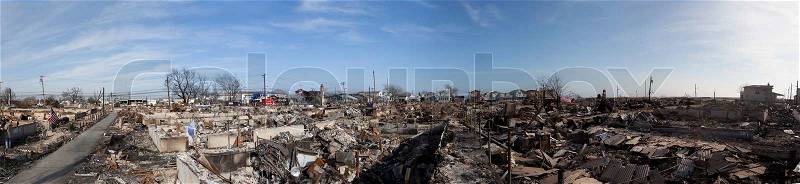 NEW YORK -November12: The fire destroyed around 100 houses during Hurricane Sandy in the flooded neighborhood at Breezy Point in Far Rockaway areaon October 29 2012 in New York City NY, stock photo
