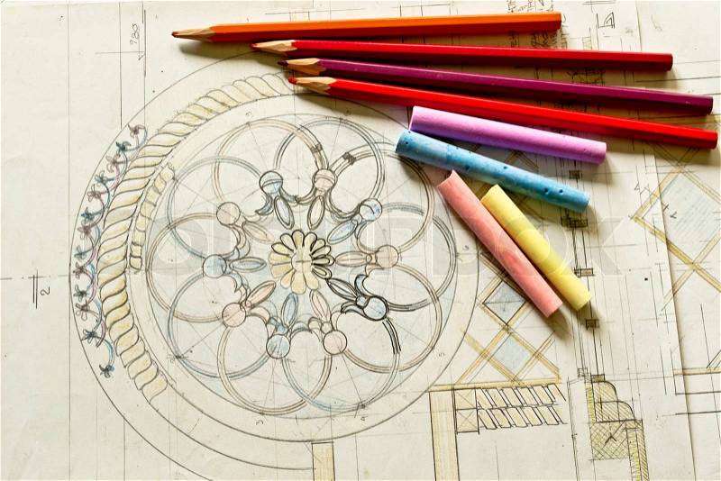 Close up of architectural blueprints with sketch of project on workplace and pencils, stock photo