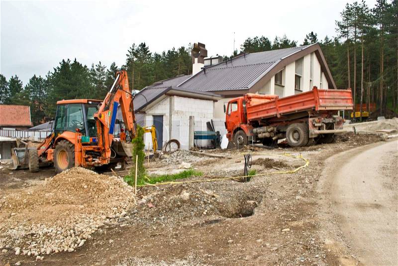 Excavator on site working,road repair,building house, stock photo