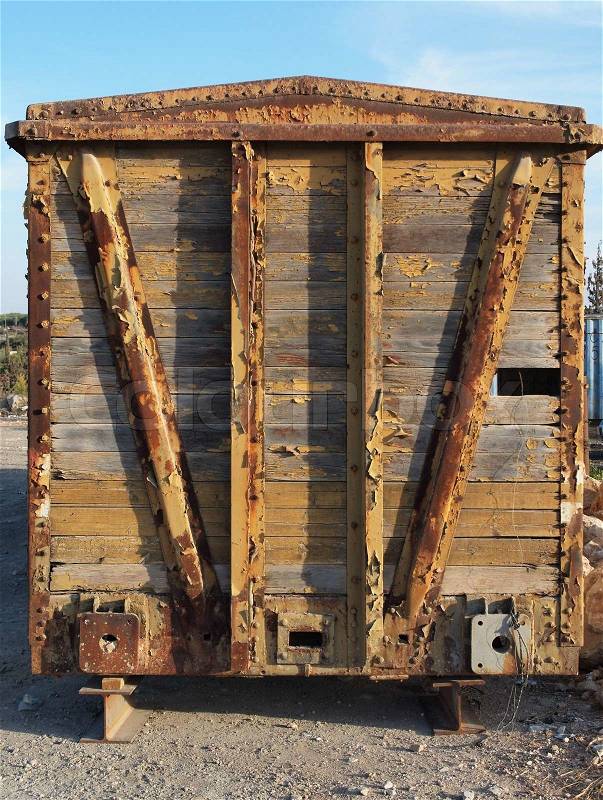Back end of abandoned wooden railway car on props, stock photo