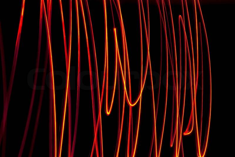 Abstract chaos fire rays on black background, stock photo