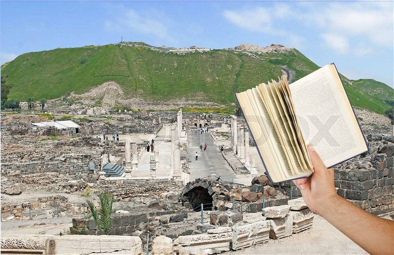Reading book aboutIsrael history, stock photo