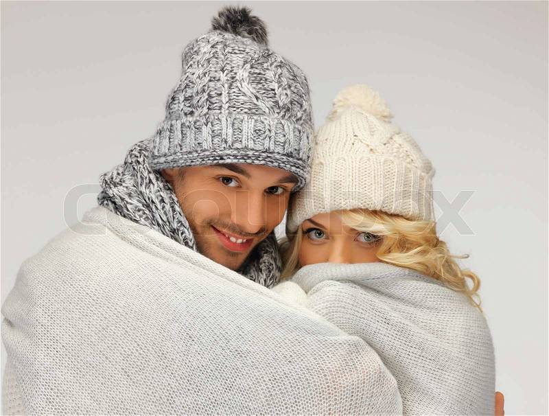 Bright picture of family couple under warm blanket focus on man, stock photo
