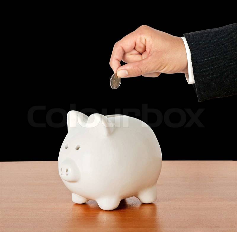 Piggy bank on desk, stock photo