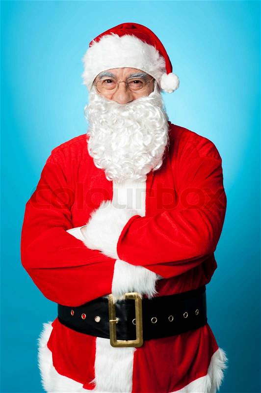 Confident aged male in Santa costume, stock photo