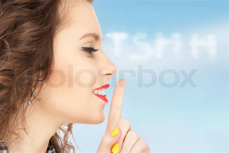 Finger on lips, stock photo