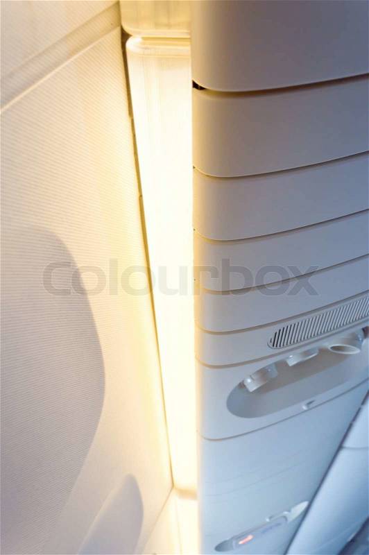 Light in commercial aircraft interior, stock photo