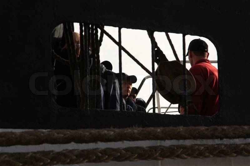Encouraging by the chief to the workmen of the ship, stock photo