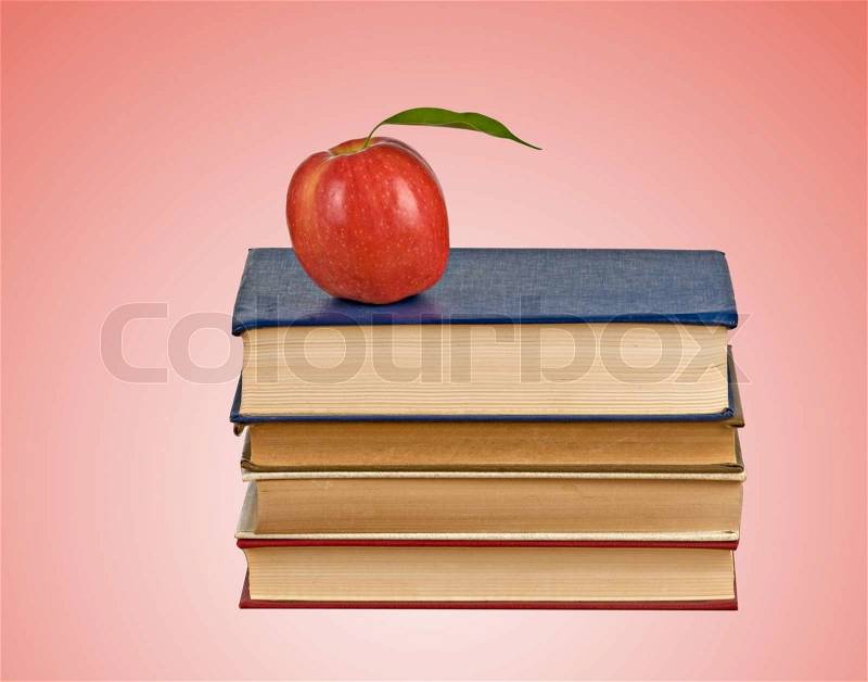 Apple on books, stock photo