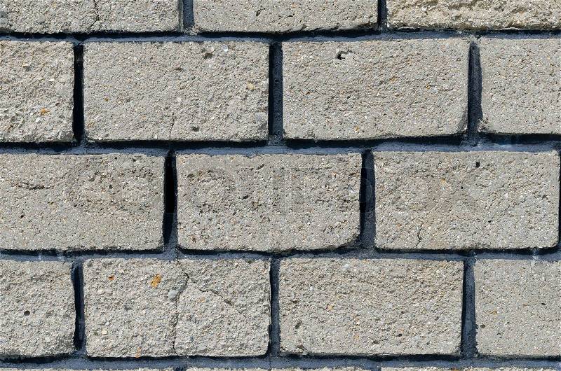 Grey brick wall close up, stock photo