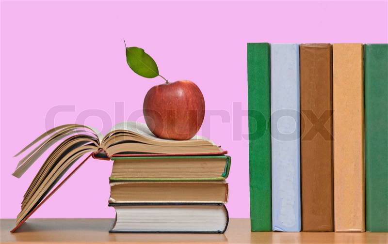Red apples and row of book, stock photo