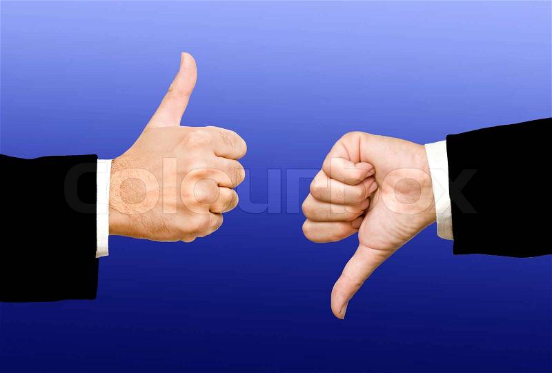 Hands showing thumb up and thumb down, stock photo