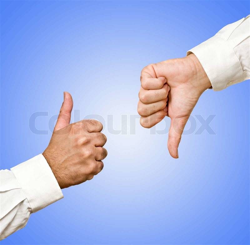 Hands showing thumb up and thumb down, stock photo