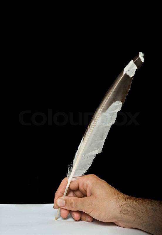 Writer writing with feather, stock photo