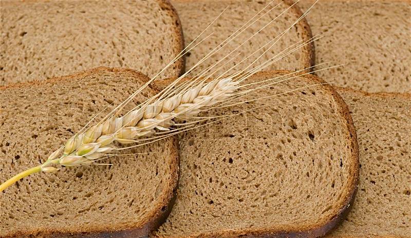 Wheat ear layng on slices of bread, stock photo