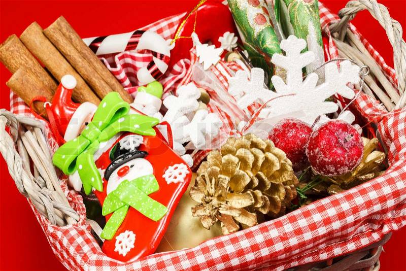 Christmas preparation basket. Basket with ribbons and christmas tags, stock photo